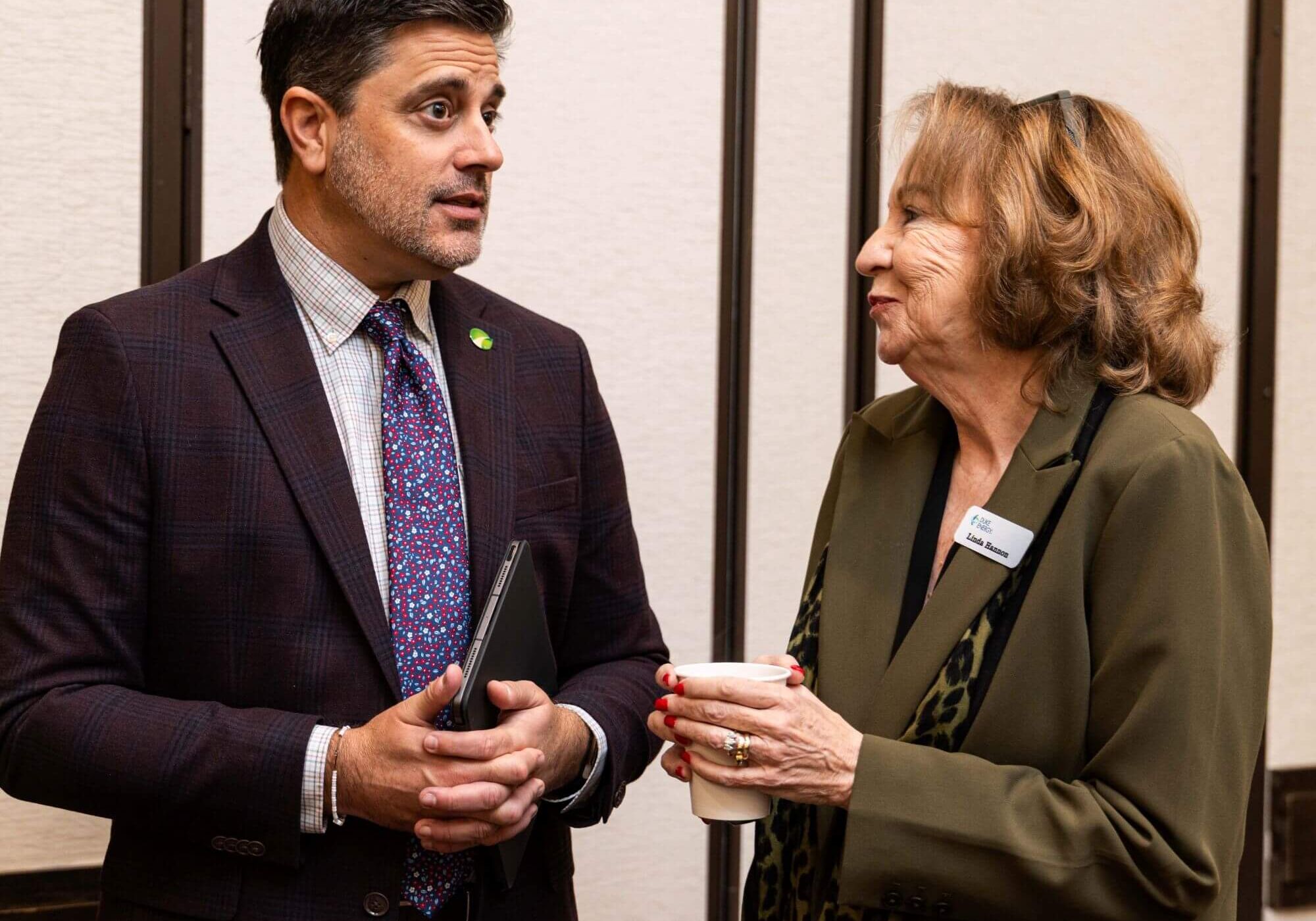 Attendees in conversation at a networking event