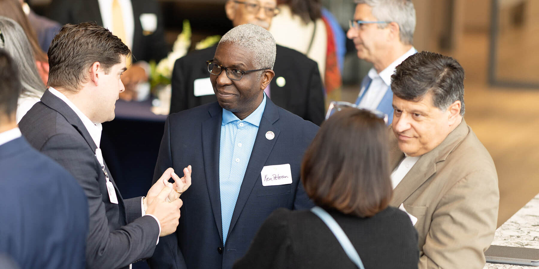 Attendees chatting at a networking reception