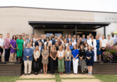 Leadership Greenville class group photo outside a building