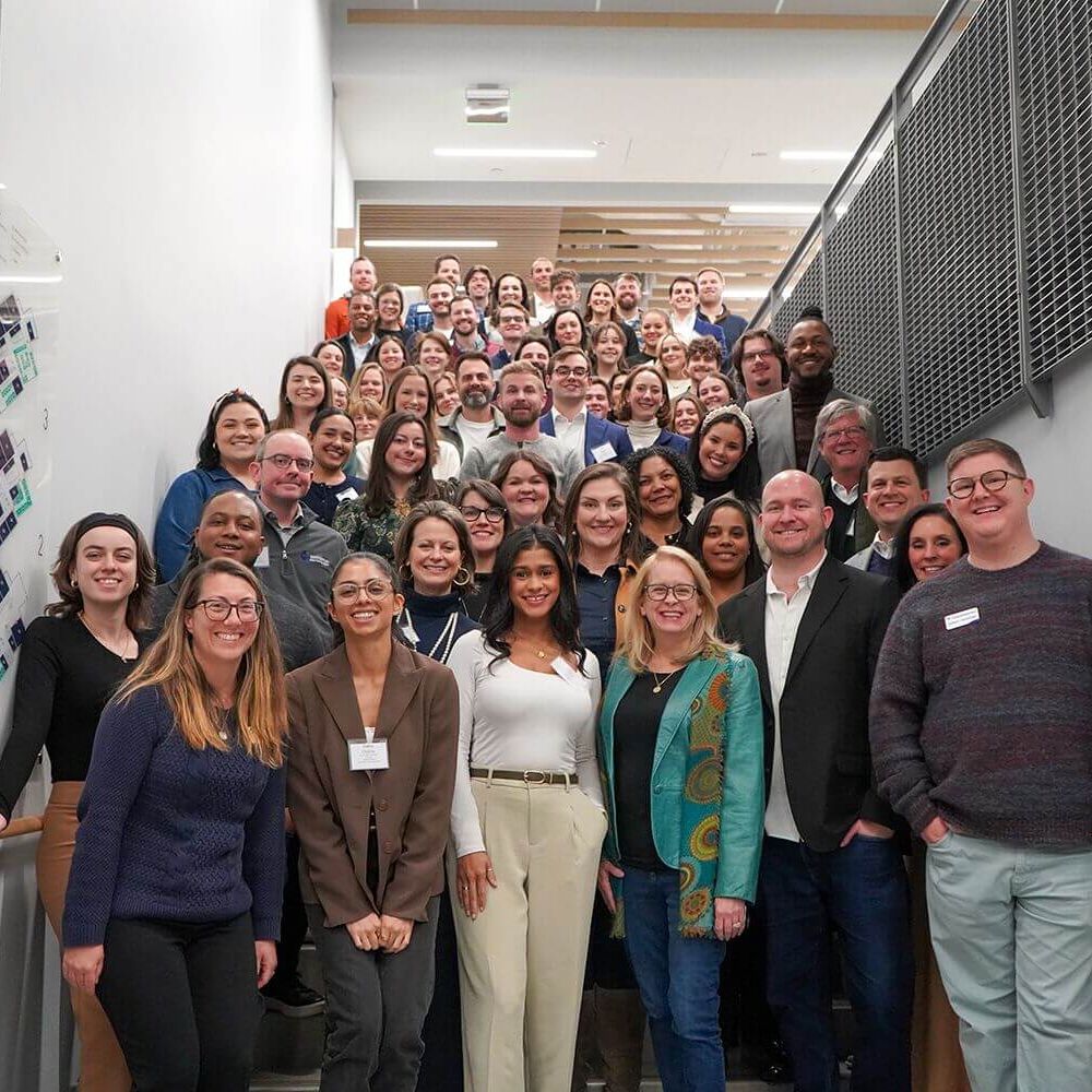 Pacesetters group photo on a staircase landing